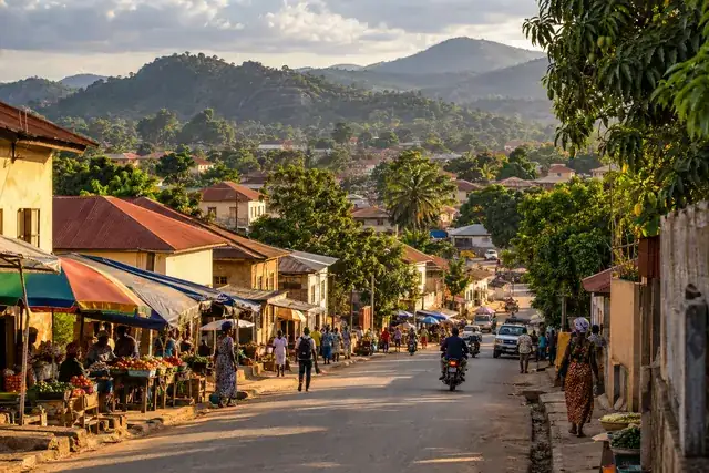 Image générée : paysage urbain guinéen imaginaire, utilisé pour illustrer la démonstration.